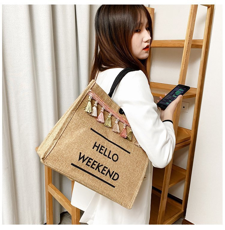 Spring and summer new ethnic style linen fabric tassel letter bag